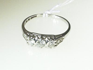 Jewellery, RING, 18K vitguldmed 3 brilliant-cut diamonds and rose- stones of total weight approx 0,47 ct ringsize 17 1/4 mm., in auction: Christmas – Saturday 14 December 2002