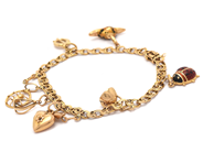 Lot, Bracelet Bismarck 18K 15,3g 19,5cm with eight charms and one that missing, with enamel and two stones missing, in auction: Pawn – Tuesday 8 September 2020