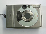 Pawnitems, 1 Digitalkamera Canon Ixus 300 2,1 pixlar with laddare, program, in auction: Pawn – Saturday 9 August 2003