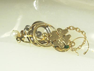 Pawnitems, 2 charms, 5 earrings, in auction: Pawn – Saturday 18 October 2003