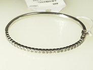 Jewellery, BANGLE, 18K white gold with brilliant-cut diamonds of total weight approx 1,16 ct approx K-L(TCAPE)/VS-SI., in auction: Classic – Saturday 24 April 2004