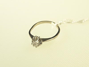 Pawnitems, 1 ring vg (skev) with dia approx 1x0,01ct 18K. weight 1,4g, in auction: Pawn – Wednesday 26 January 2005