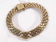 Pawnitems, 1 bracelet "x-link" approx 19cm, 18K. weight 18,5g, in auction: Pawn – Wednesday 26 October 2005