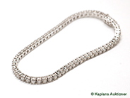 Jewellery, TENNISARMBAND in 18K white gold with 62 brilliant-cut diamonds approx 5,60 cts total weight, approx TW/VS (en dia skadad), in auction: Modern – Saturday 11 November 2006