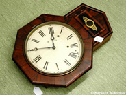 Pawnitems, Wallclock, with skador on dial and repa on träramen length approx 59cm width 42cm inkl.ram, in auction: Pawn – Tuesday 17 June 2008
