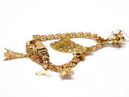 Pawnitems, Bracelet, 18K Bismarck 18.5cm with safety-chain and 5 breloques 27,3g, in auction: Pawn – Tuesday 16 November 2010