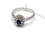 Jewellery, Ring white gold with stone and small diamonds (a dia missing) 18K SIZE 19 3/4 5,1g, in auction: Pawn – Tuesday 5 November 2013