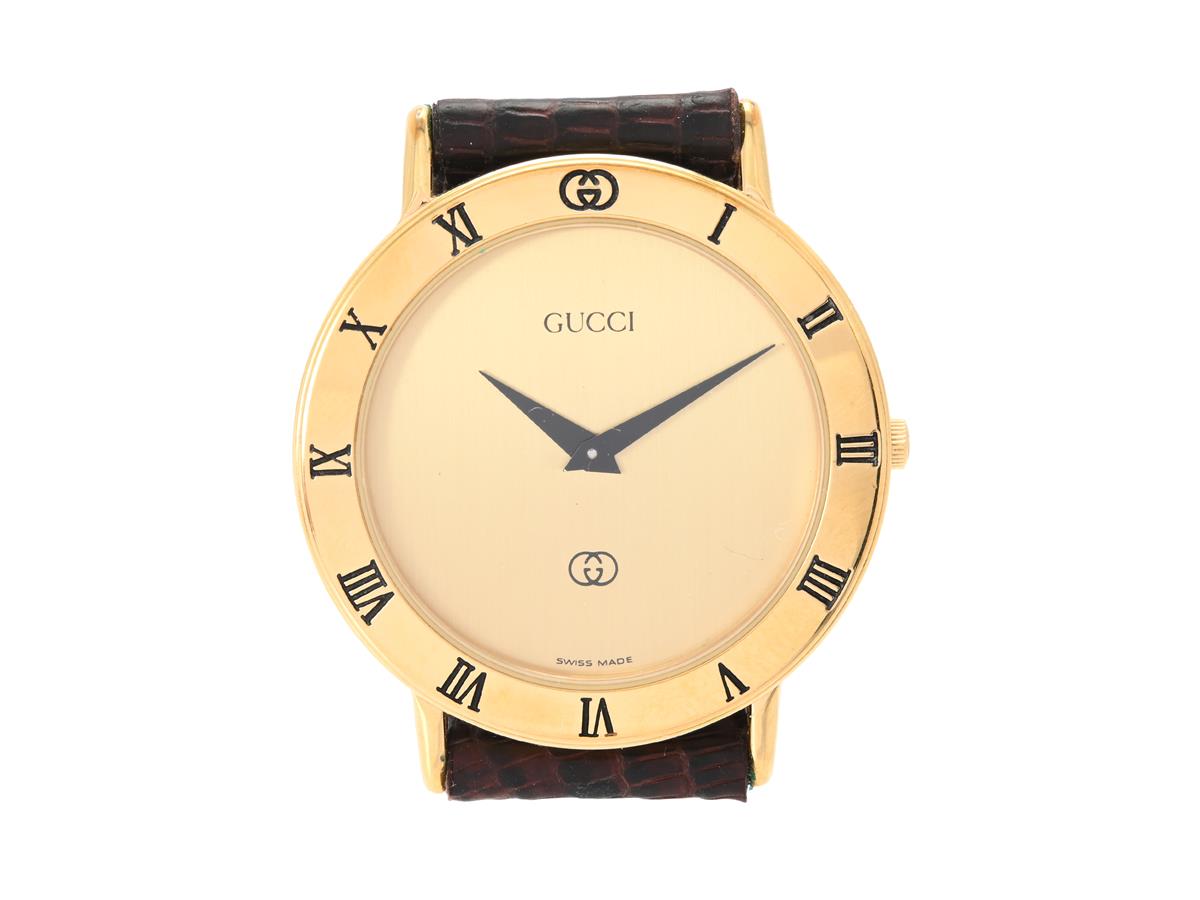 GUCCI, herrur, 33 mm, Serie nr. 0025969, Boett nr. 3000 M, doublé (10 micron), quartz, mineralglas, defekt (går ej), läderband, originalspänne i gulmetall, ca 1990, box.