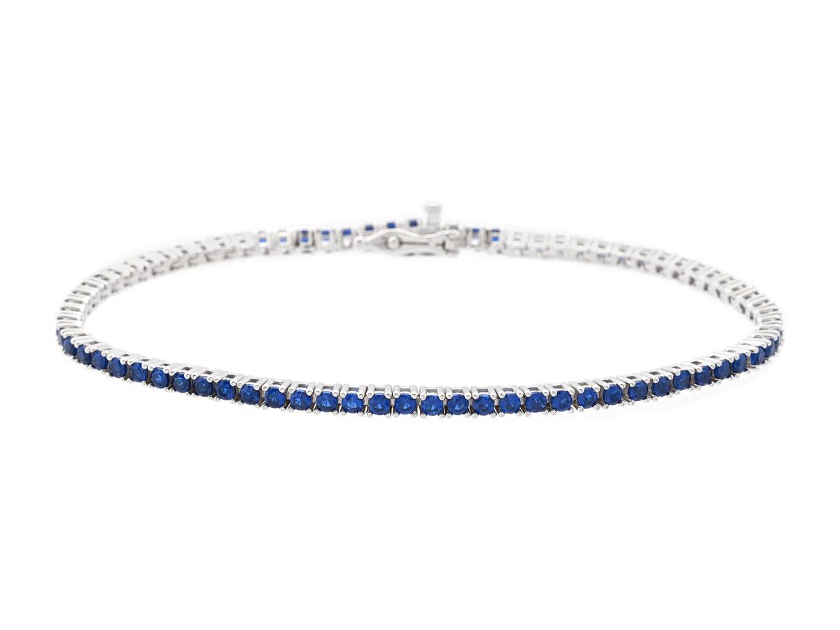 TENNISARMBAND, sterlingsilver, blå stenar, längd 18 cm, vikt 6,6 g.