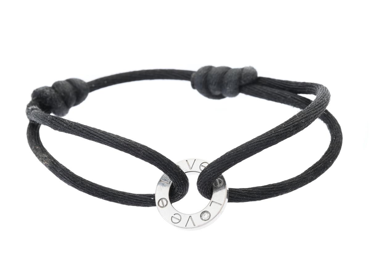 CARTIER, armband, Love, 18K vitguld, svart sidenband, briljantslipade diamanter ca 0,02 ctv, ca TW/VVS, serienr PP8110, längd ca 18 cm, vikt 3,5 g, slitage och nötning på siden.