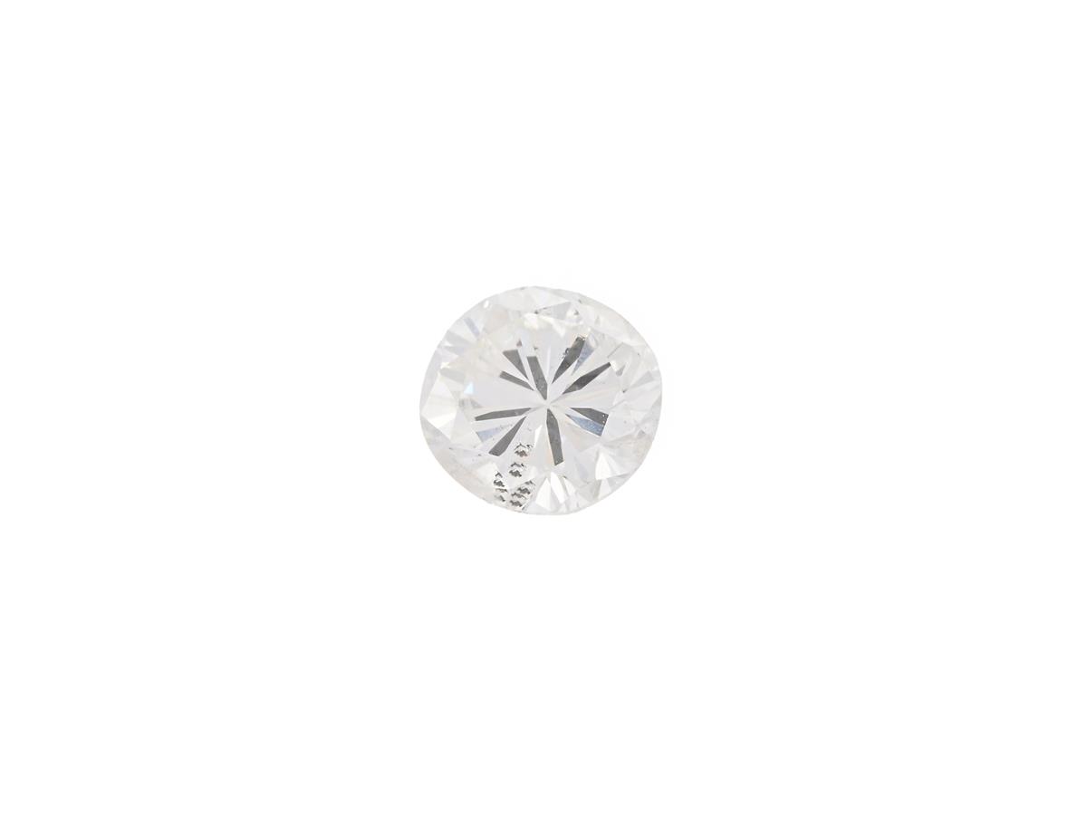 DIAMANT, briljantslipad, 0,61 ct, W(H)/P1, nagg på kuletten, en natural samt en extrafacett vid rondisten.