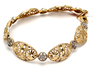 Smycken, Armband tvåfärgat 14K 9,7g 19cm, med vita stenar, i auktion: Pant – Tisdag 5 mars 2019