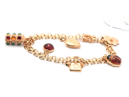 Smycken, Armband X-länk 18K 21g 20cm med sex berlocker, i auktion: Pant – Tisdag 21 april 2020