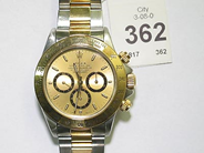 Pantvaror, 1 Armbandsur Daytona med länk guld/stål ref 16523 februari 99 cert och box, i auktion: Pant – Lördag 9 augusti 2003