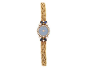 CORUM, damur, 15 mm, Boett nr. 369/993, 18K guld, quartz, safirglas, diamantkrans (24 st. 8/8, TW/VS, ca 0,20 ctv + 10 st briljanter, TW/VS, ca 0,26 ctv + 4 st. navelslipade safirer, ca 0,40 ctv), skadad urtavla, integrerad originallänk, längd 150-155 mm, totalvikt 22,1 gram, ca 1985, etui, ytterkar