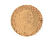MYNT, 21,6K guld, 10 Kronor, 1874, Oscar II, kvalité ca 1/1+, diamerter 18 mm, vikt 4,5 g. på auktion i Stockholm, Stockholms län hos Kaplans Auktioner