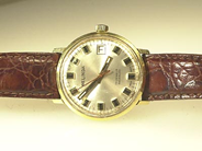 Pantvaror, 1 Herrarmbandsur Belinda 18k med läderarmband, i auktion: Pant – Onsdag 20 april 2005